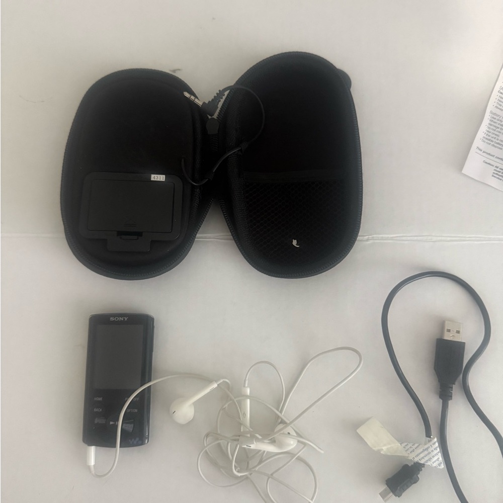 Sony Black MP3 Player with White Earbuds and Black Carry Case